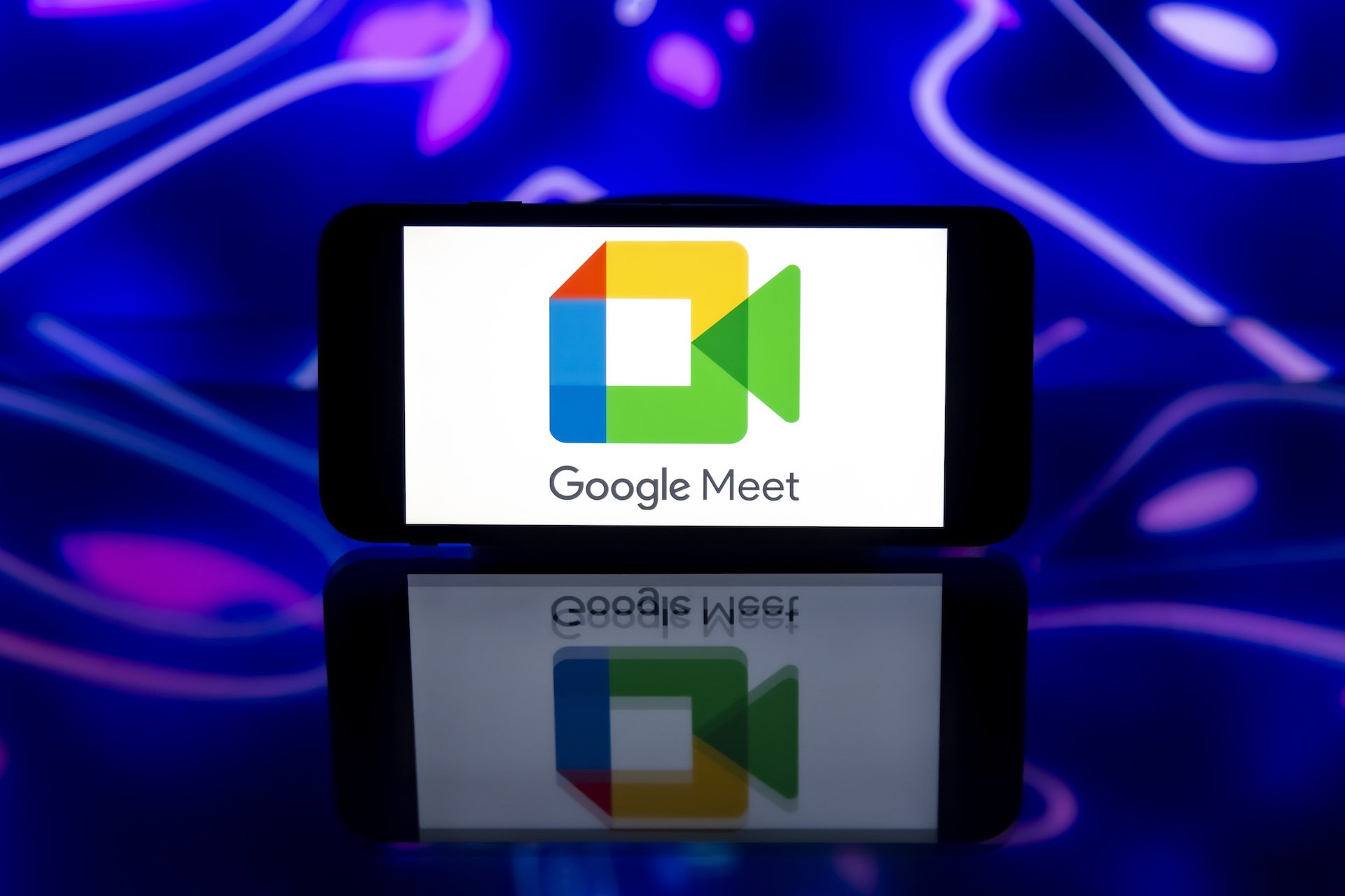 Google Meet logo on a mobile phone.