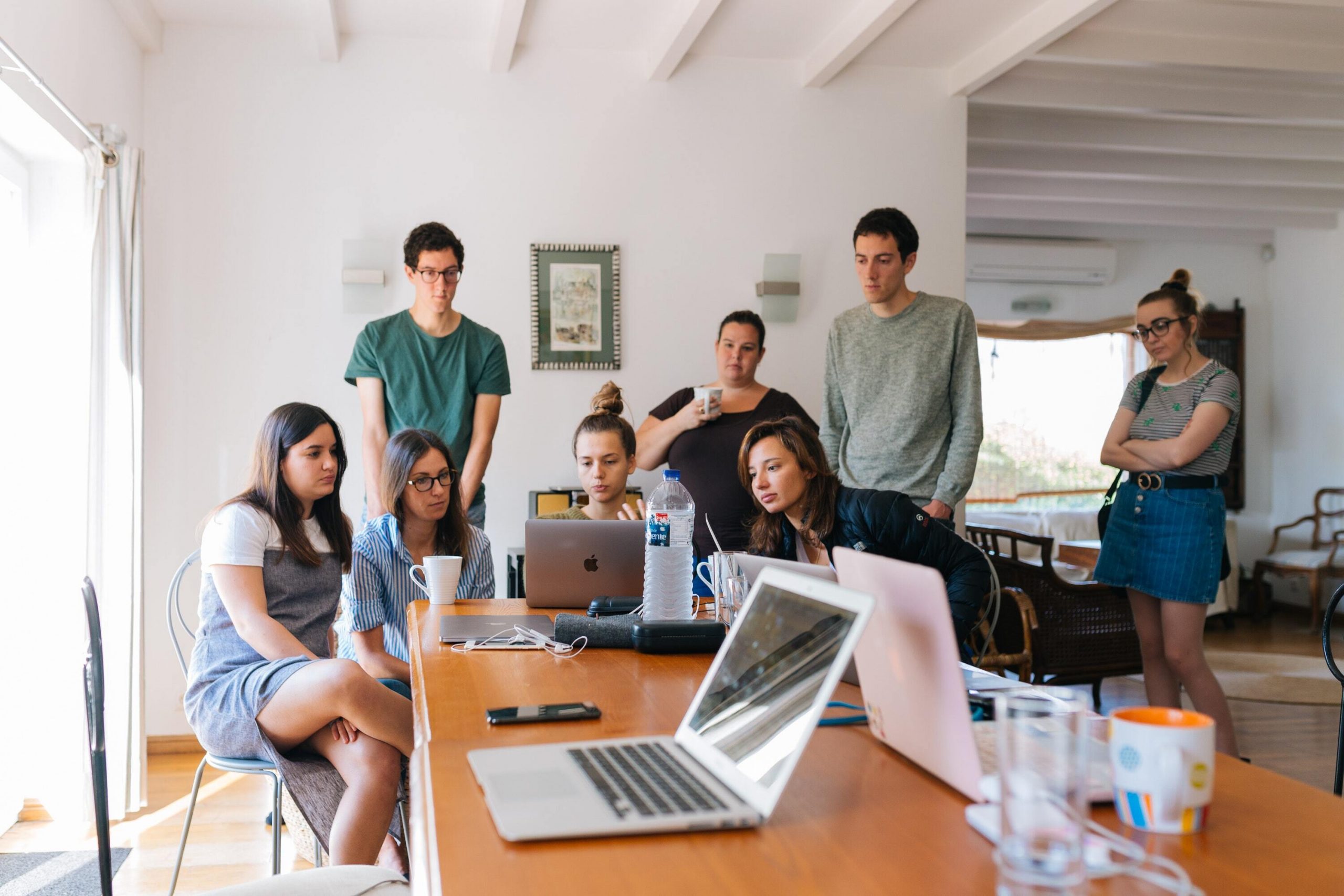 Group of people looking at laptops