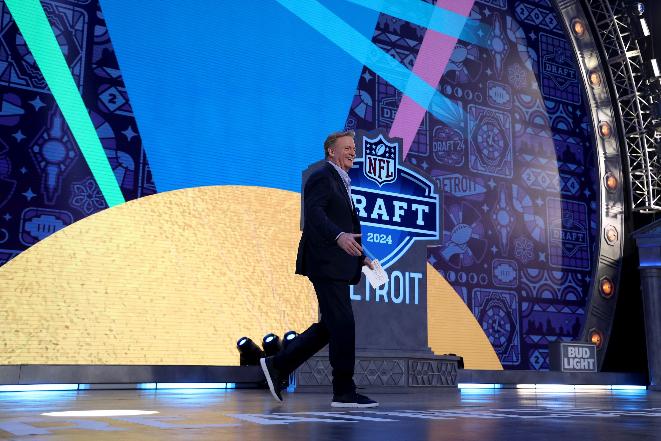 nfl commissioner roger goodell walking across the nfl draft stage