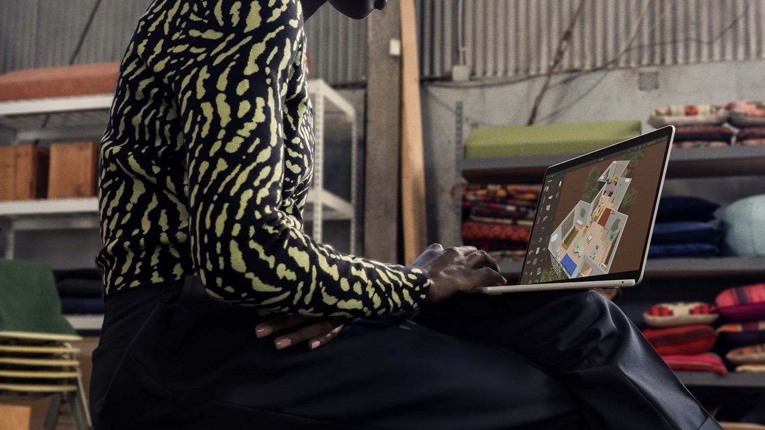 person working with m3 macbook air on their lap