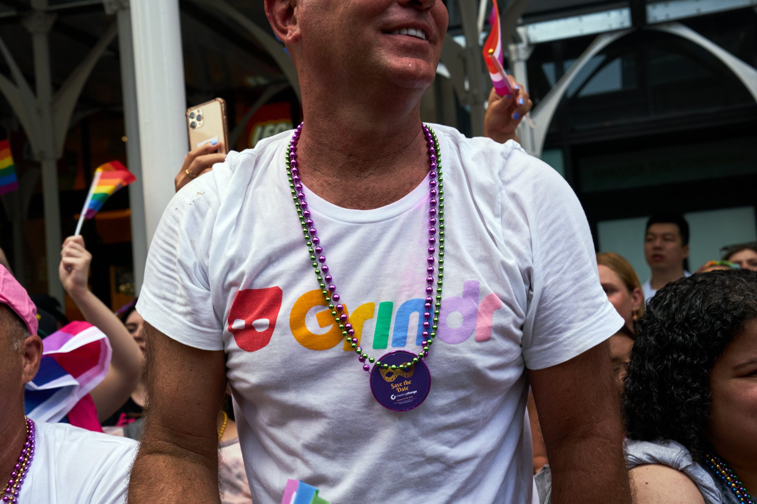 A bystander wears a Grindr t-shirt during the NYC Pride March