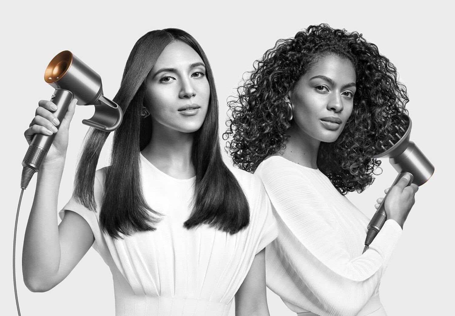 two people both use a dyson supersonic hair dryer