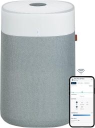 a blue air blue pure 211i max air purifier with smartphone displaying the associated app