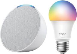 The Amazon Echo Dot in Glacier White next to the rainbow TP-Link Smart Color Bulb.