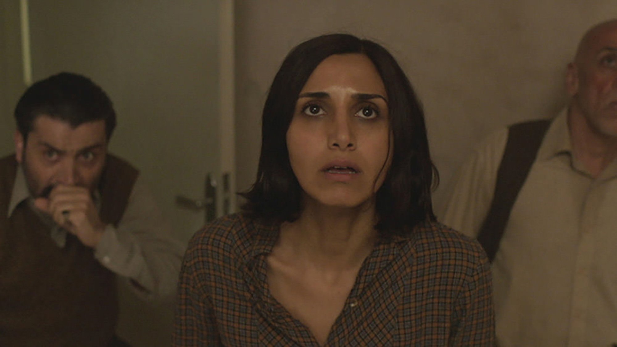 Narges Rashidi stares up at something terrifying on the ceiling in the film "Under the Shadow."