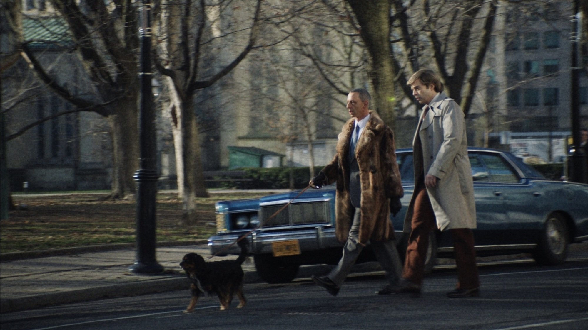 Roy Cohn and Donald Trump walk Cohn's dog in New York City.