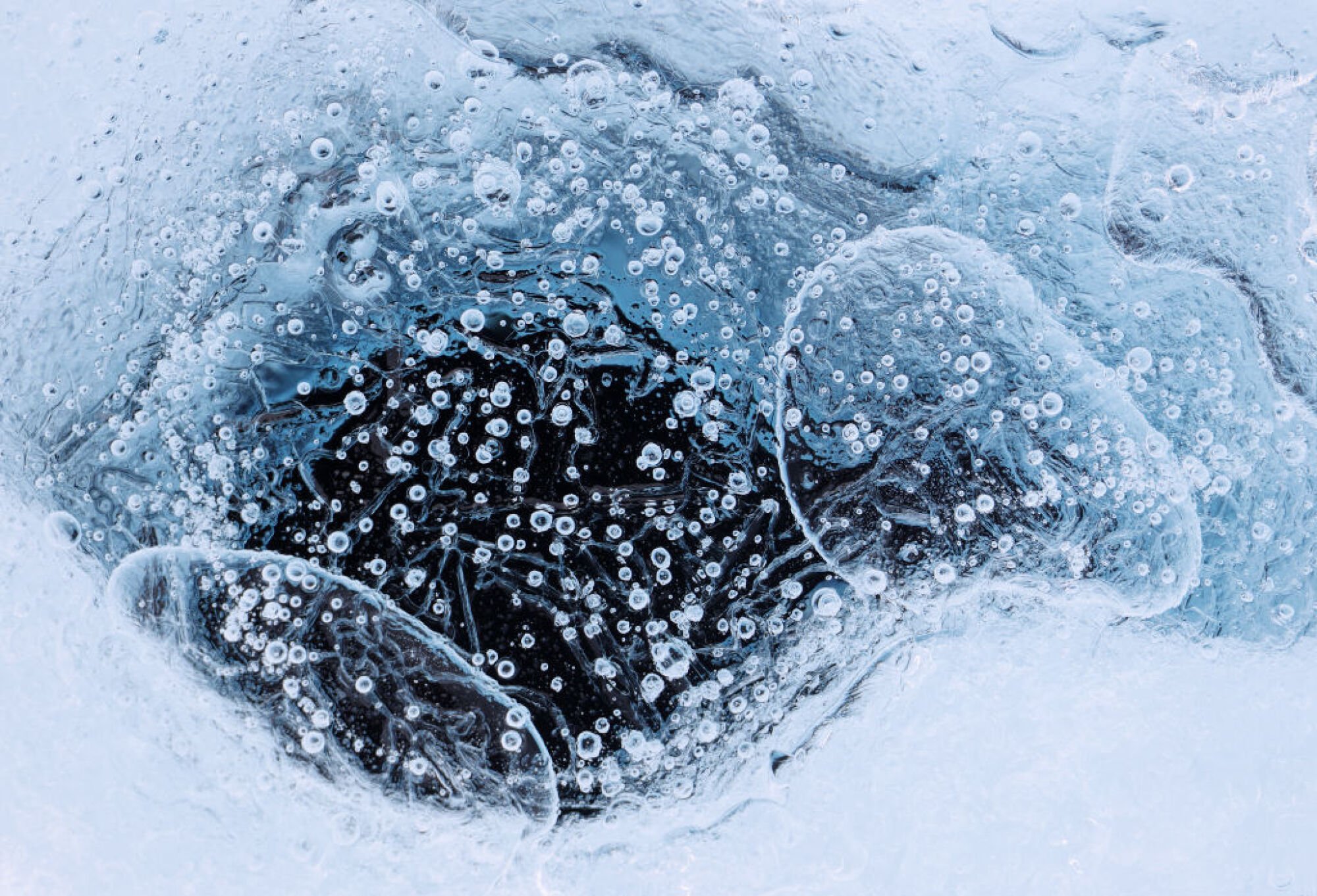 A cryoconite hole on the Isunnguata Sermia glacier in Greenland.