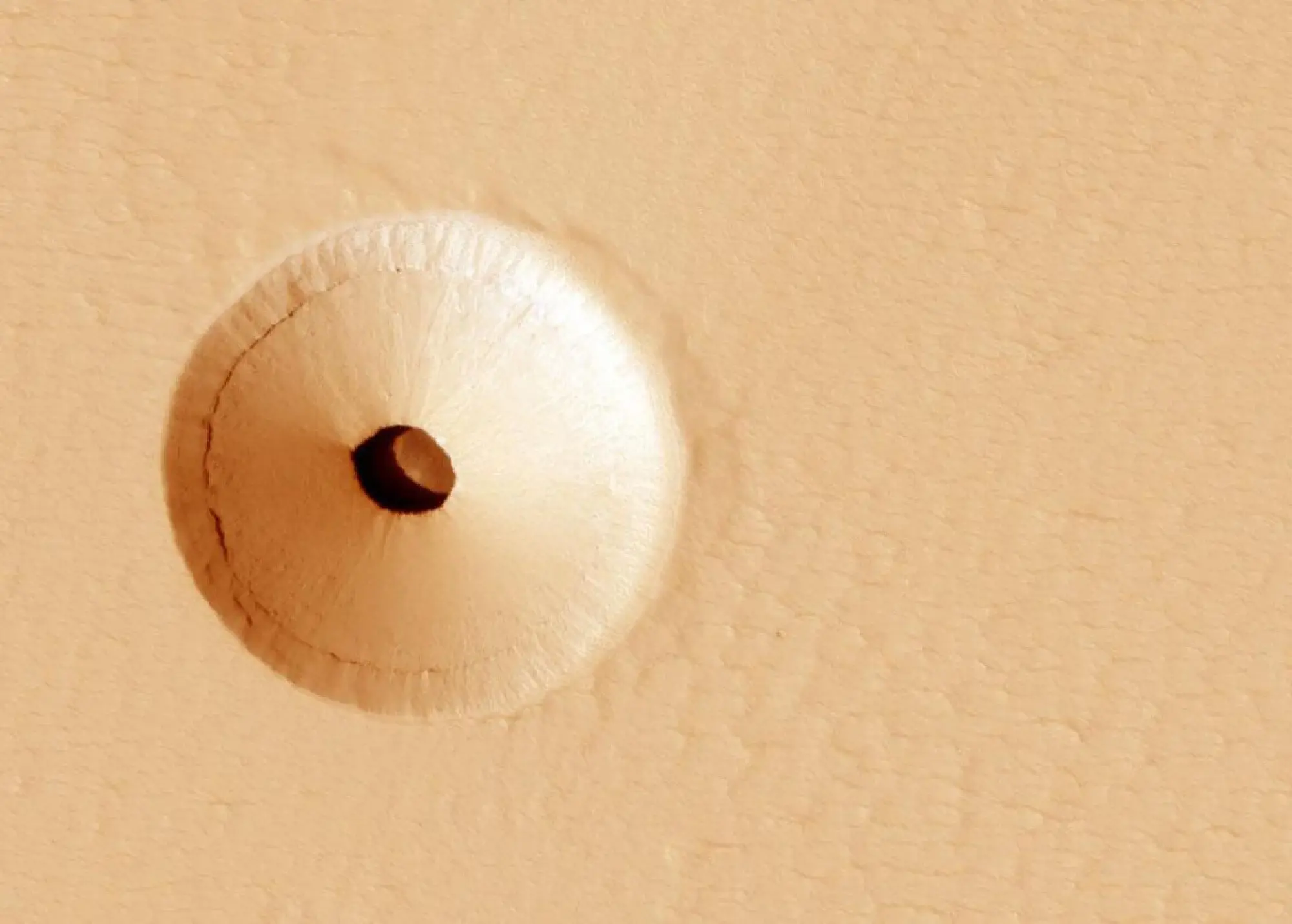 Orbiter looking down at a Martian cave