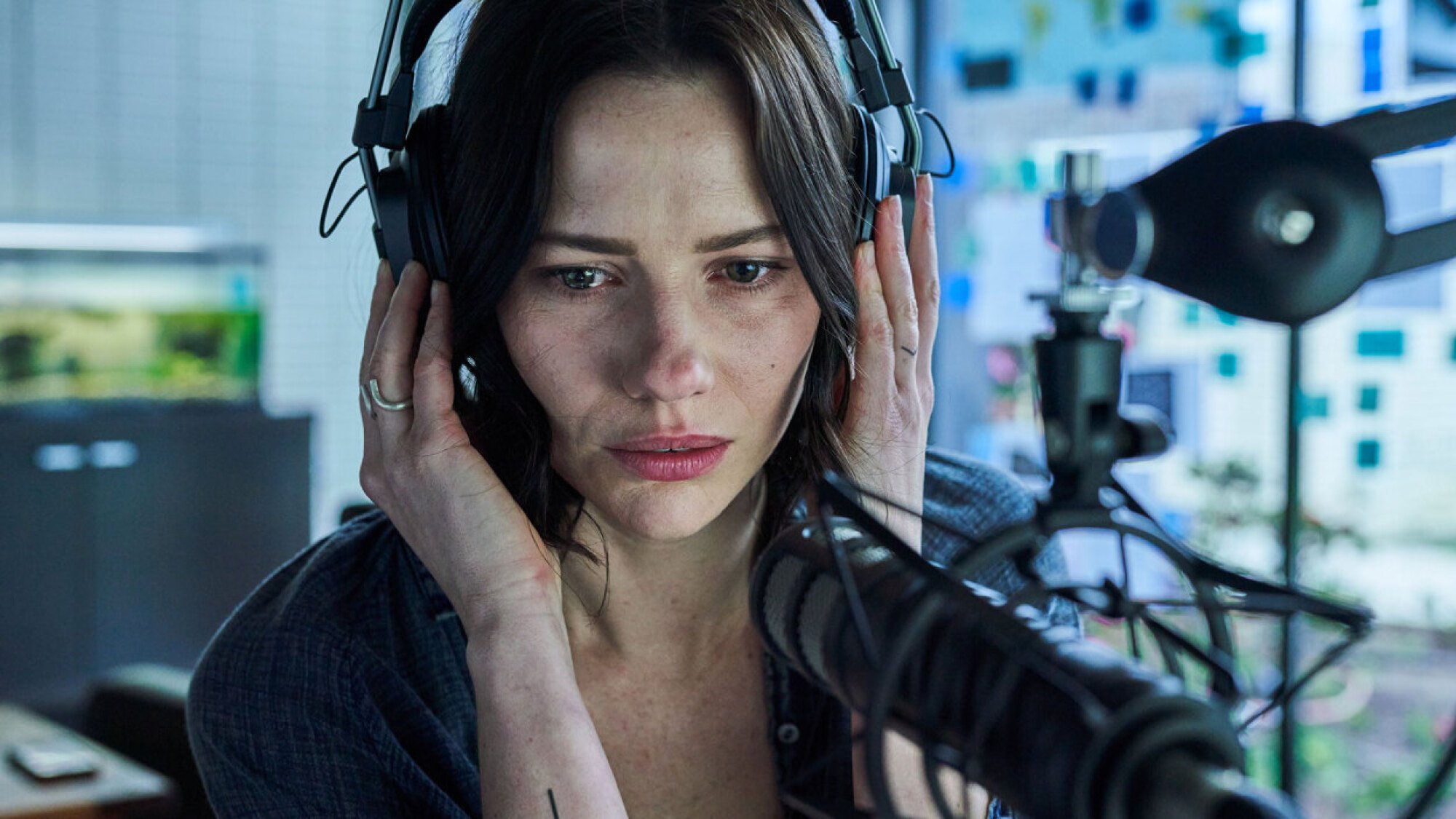 A woman records in an at-home studio in the film "Monolith".