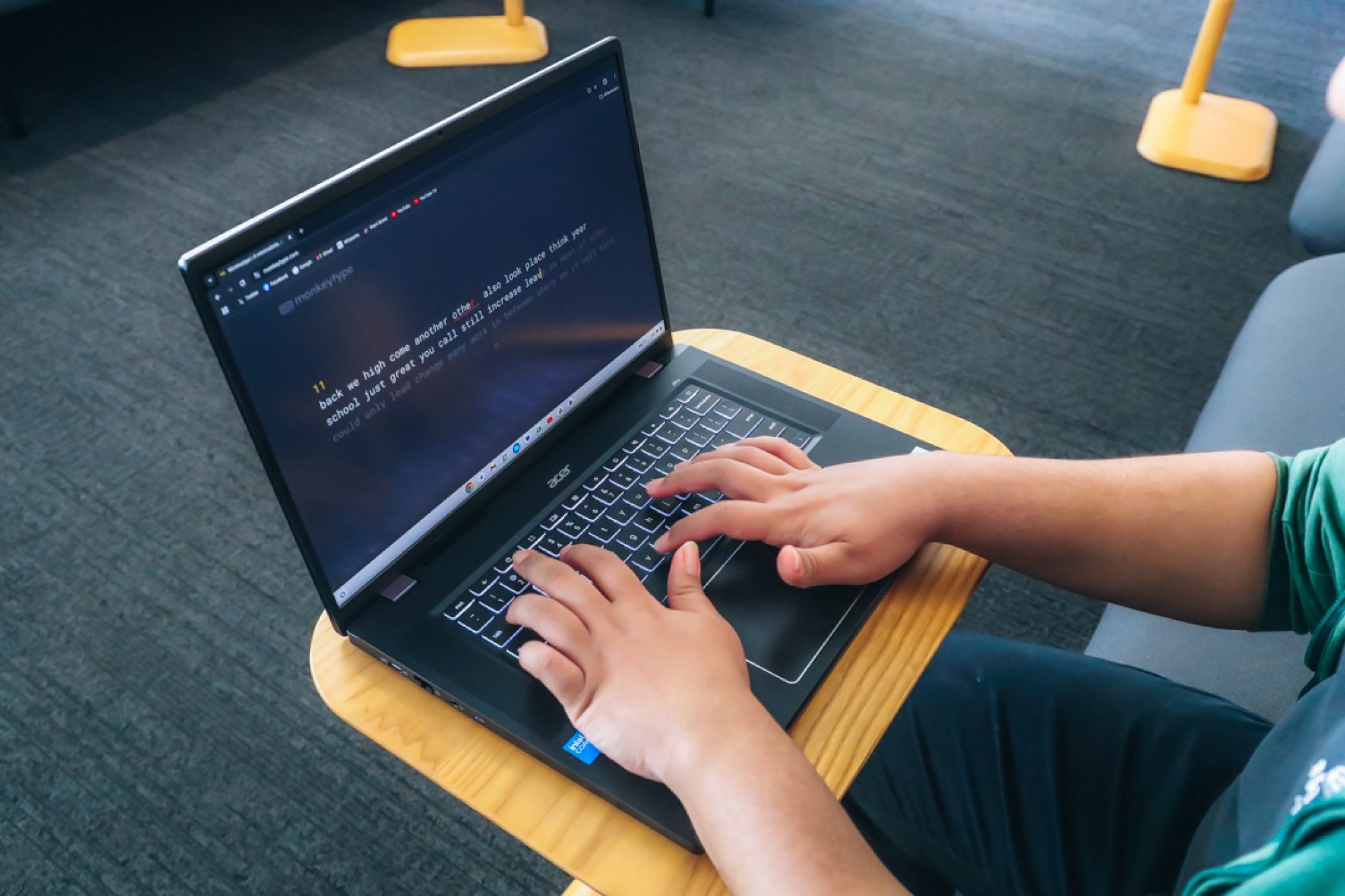 Acer Chromebook Plus 516 GE on a desk with hands typing on the keyboard