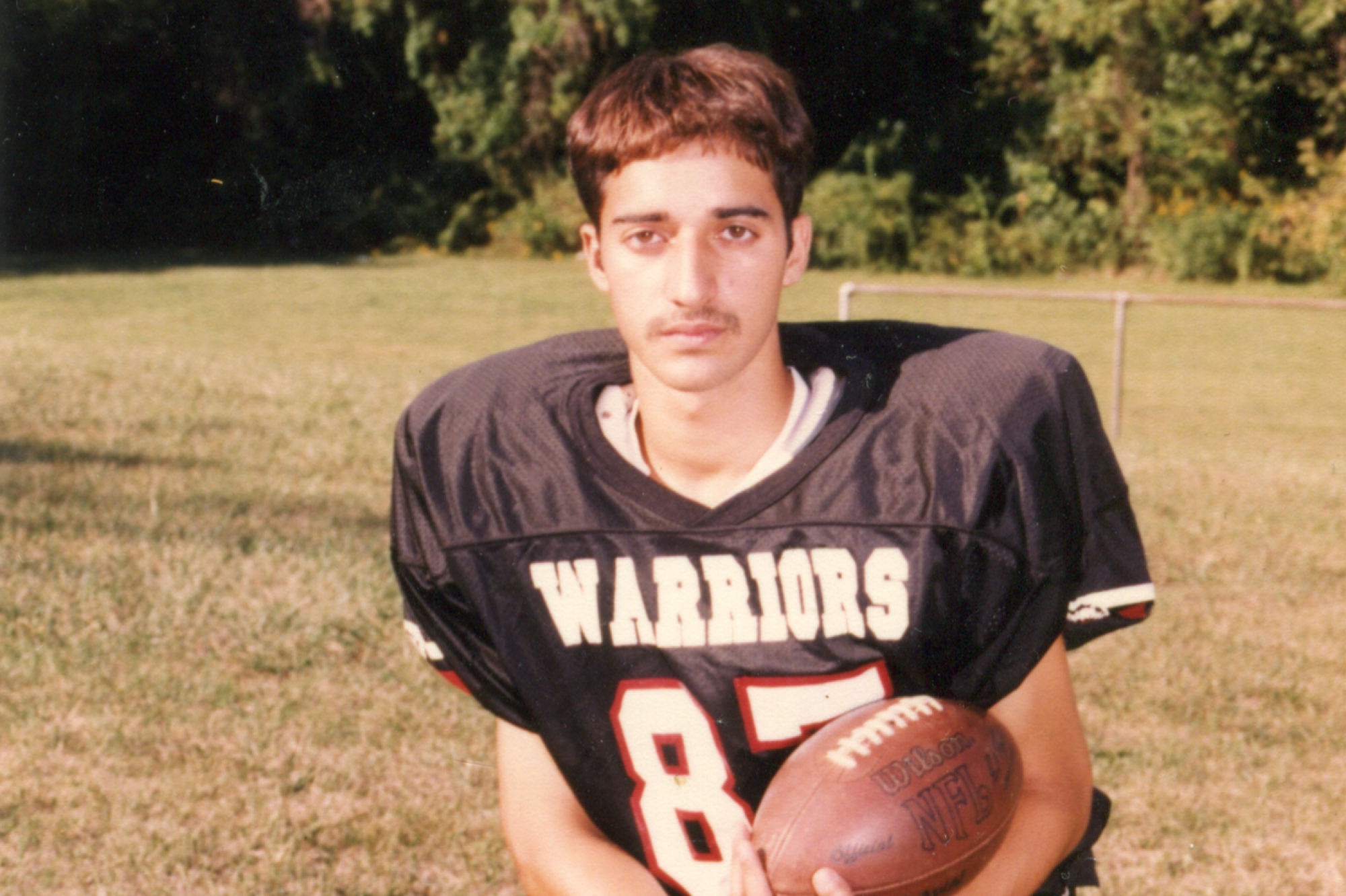 A photo of Adnan Syed holding a football.