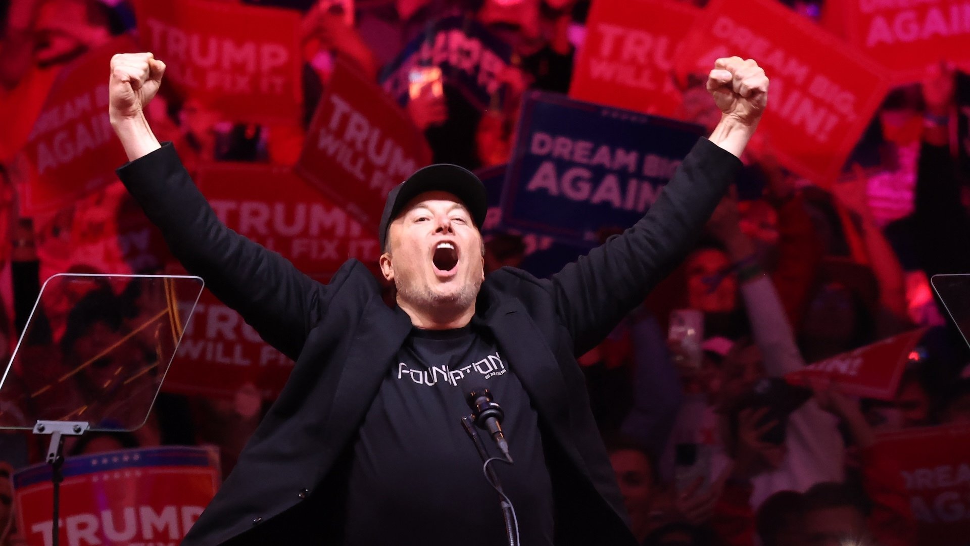 Elon Musk screaming at a Donald Trump rally.