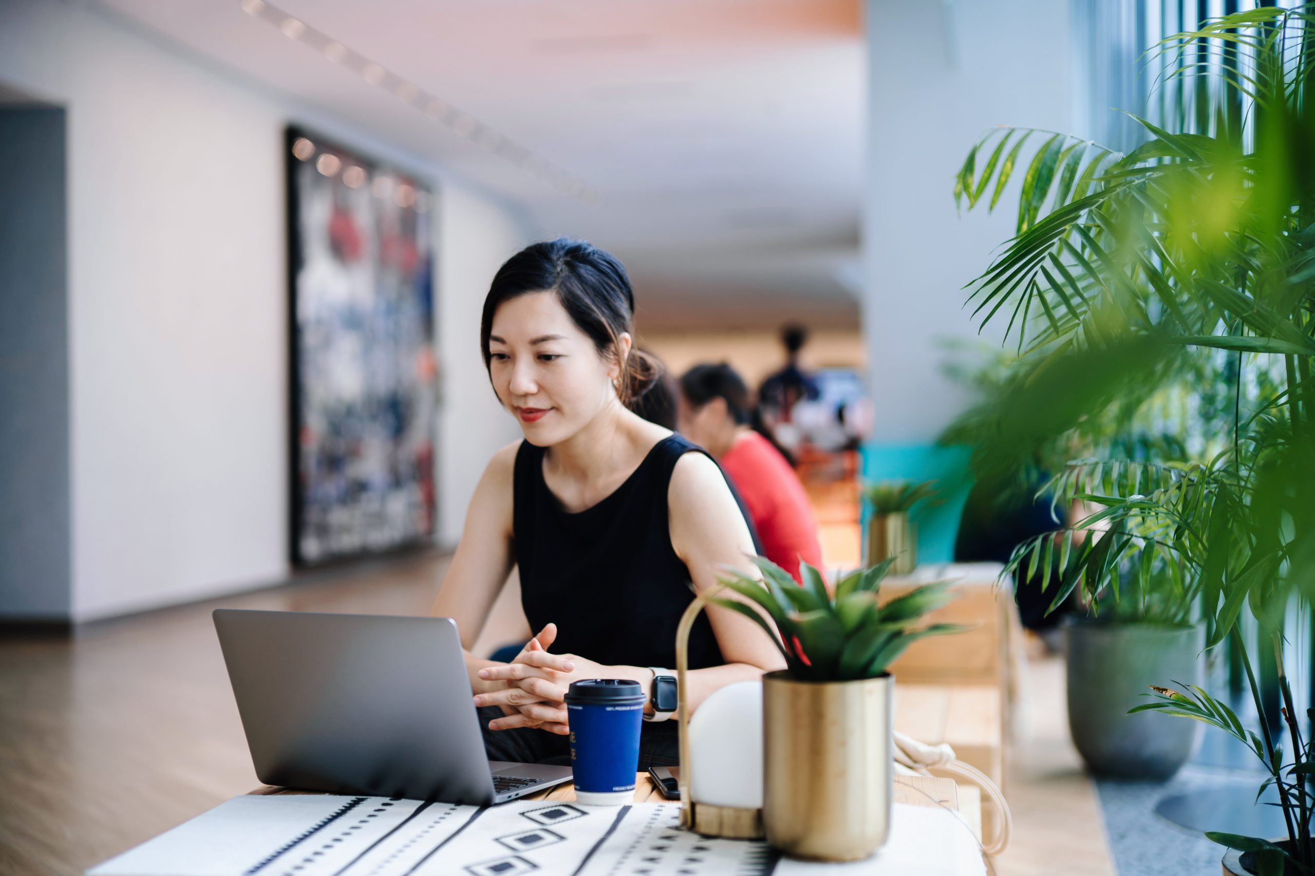 Young Asian businesswoman working in a modern office space