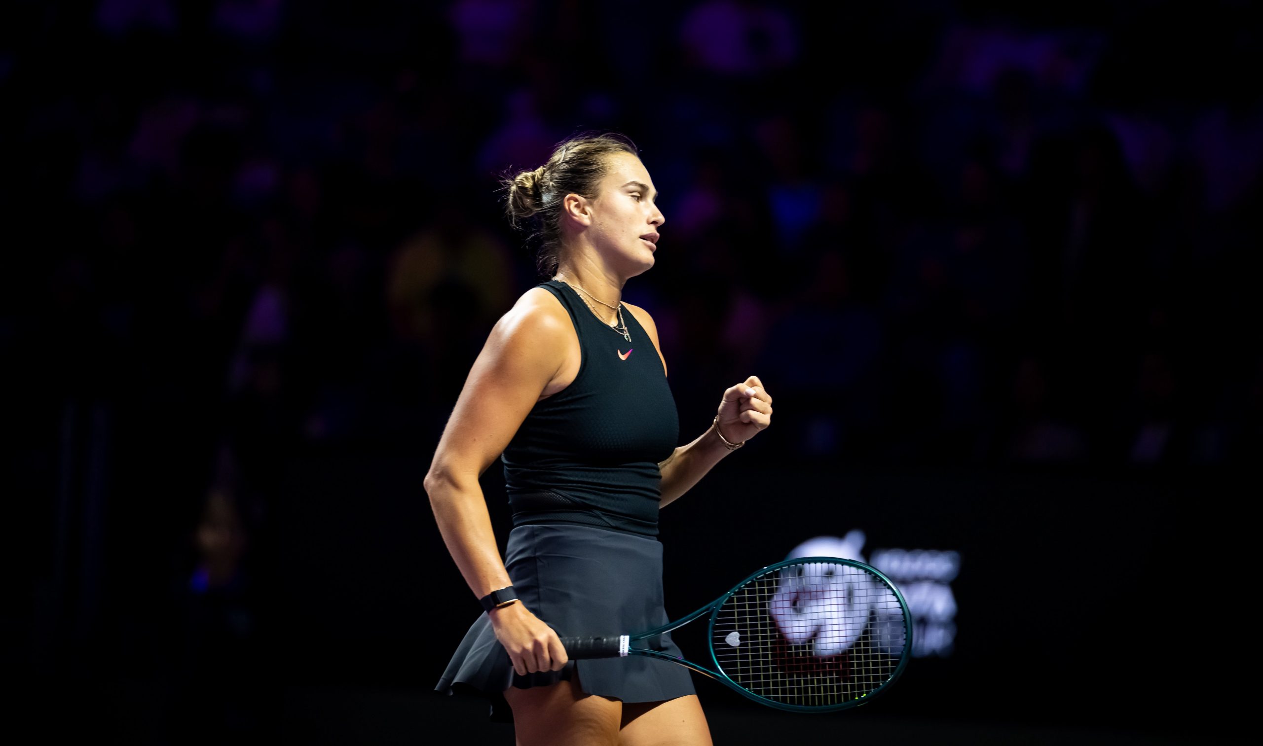 Aryna Sabalenka reacts while playing against Qinwen Zheng