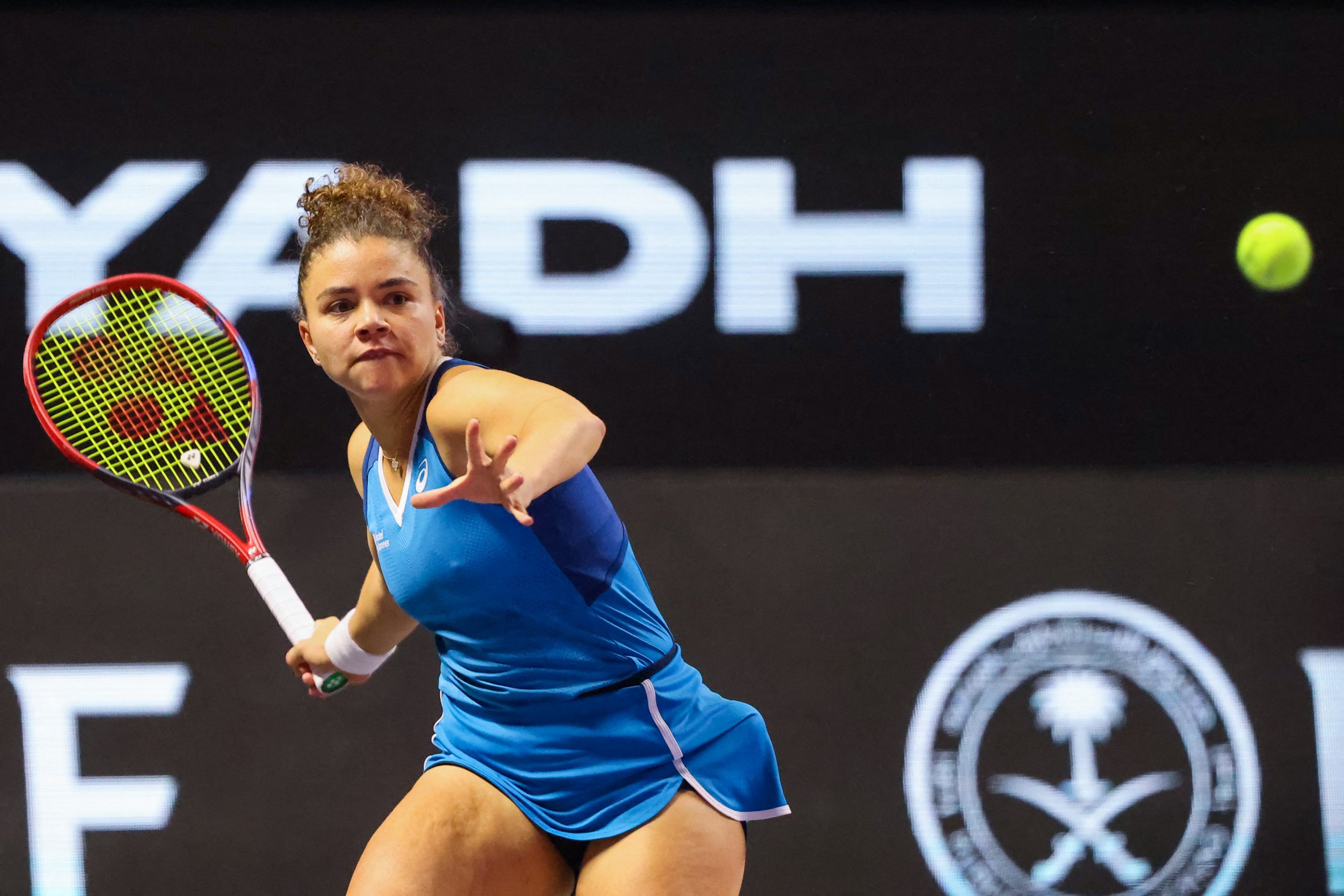 Italy's Jasmine Paolini returns the ball