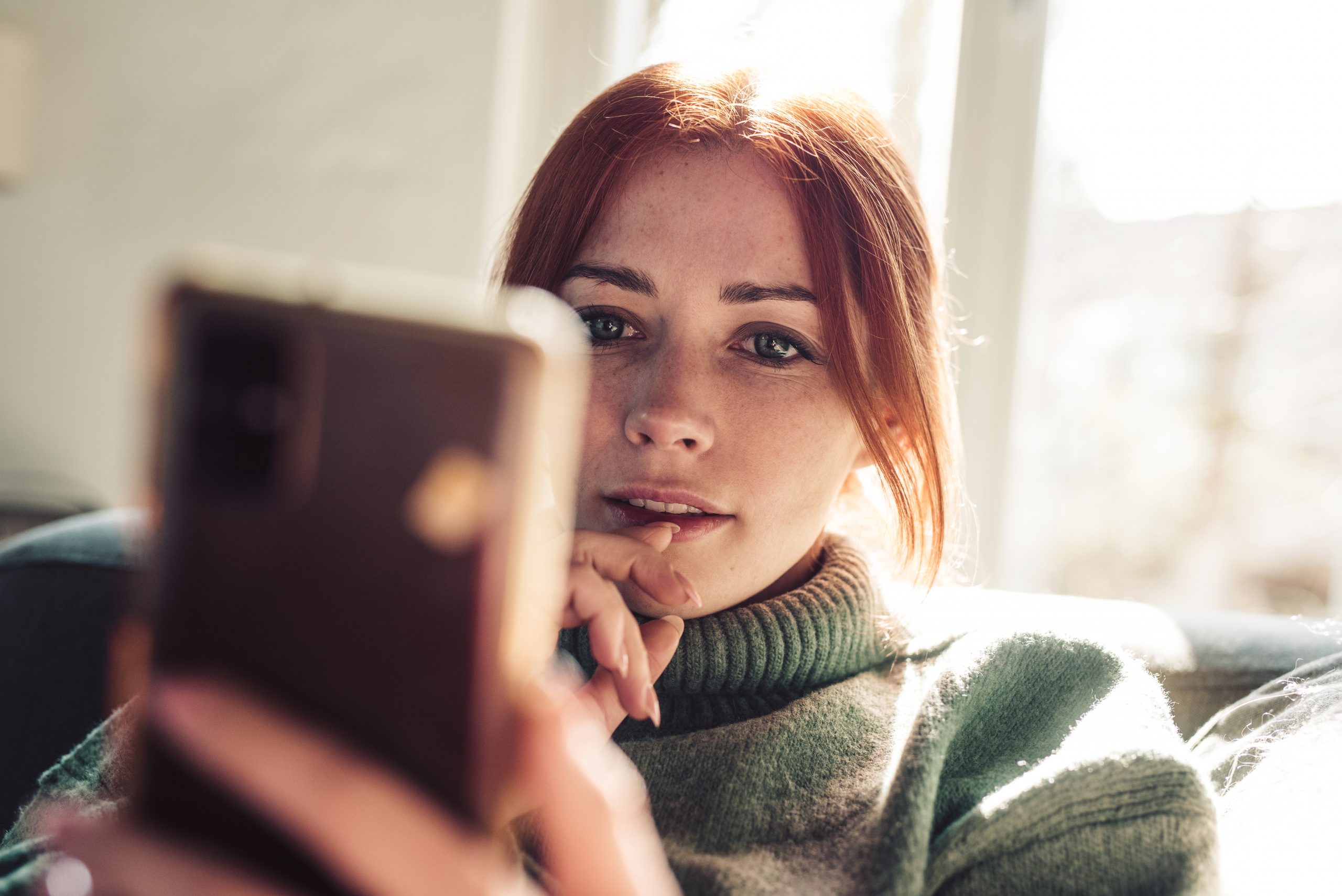 woman reading on her phone