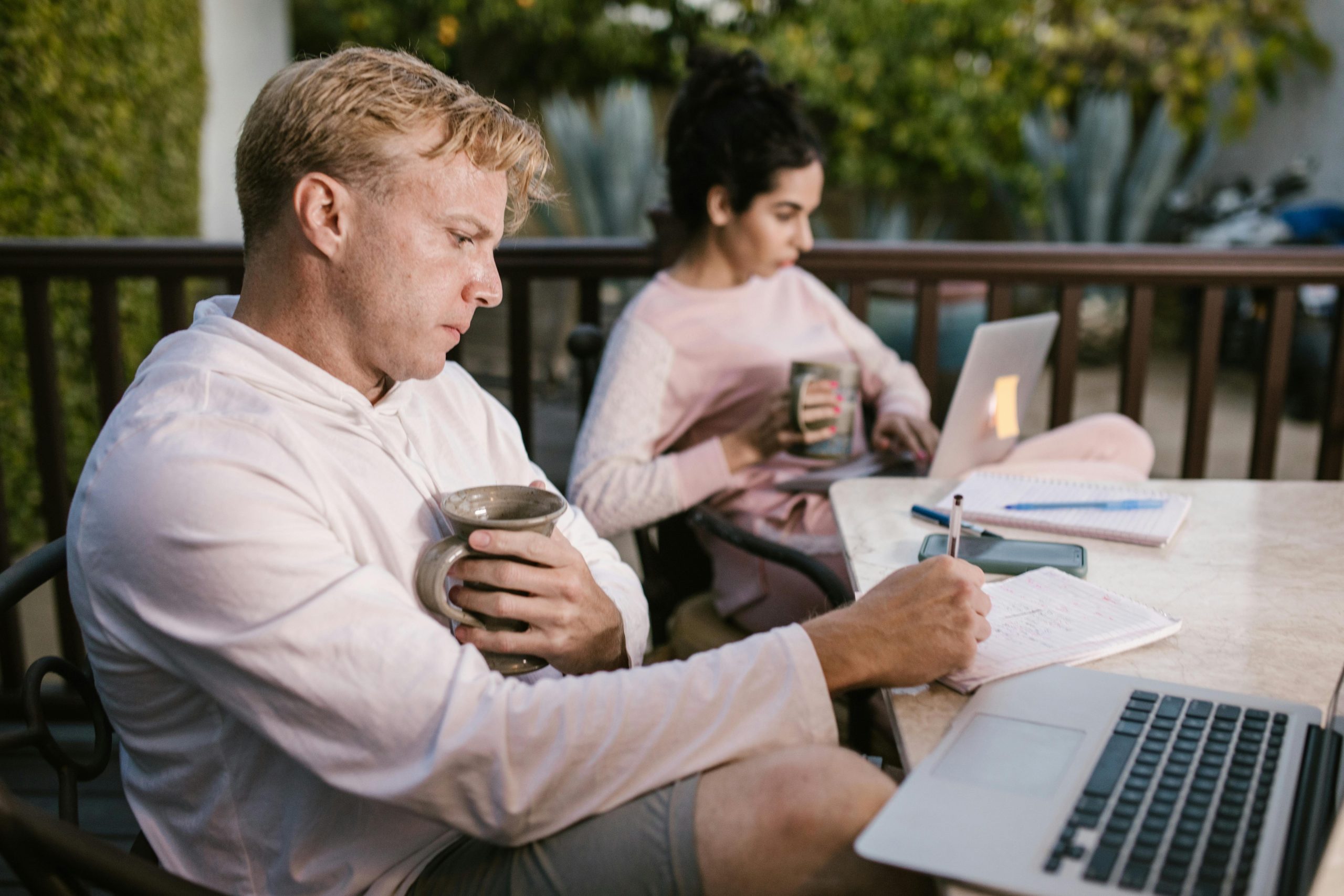 Couple looking at laptops