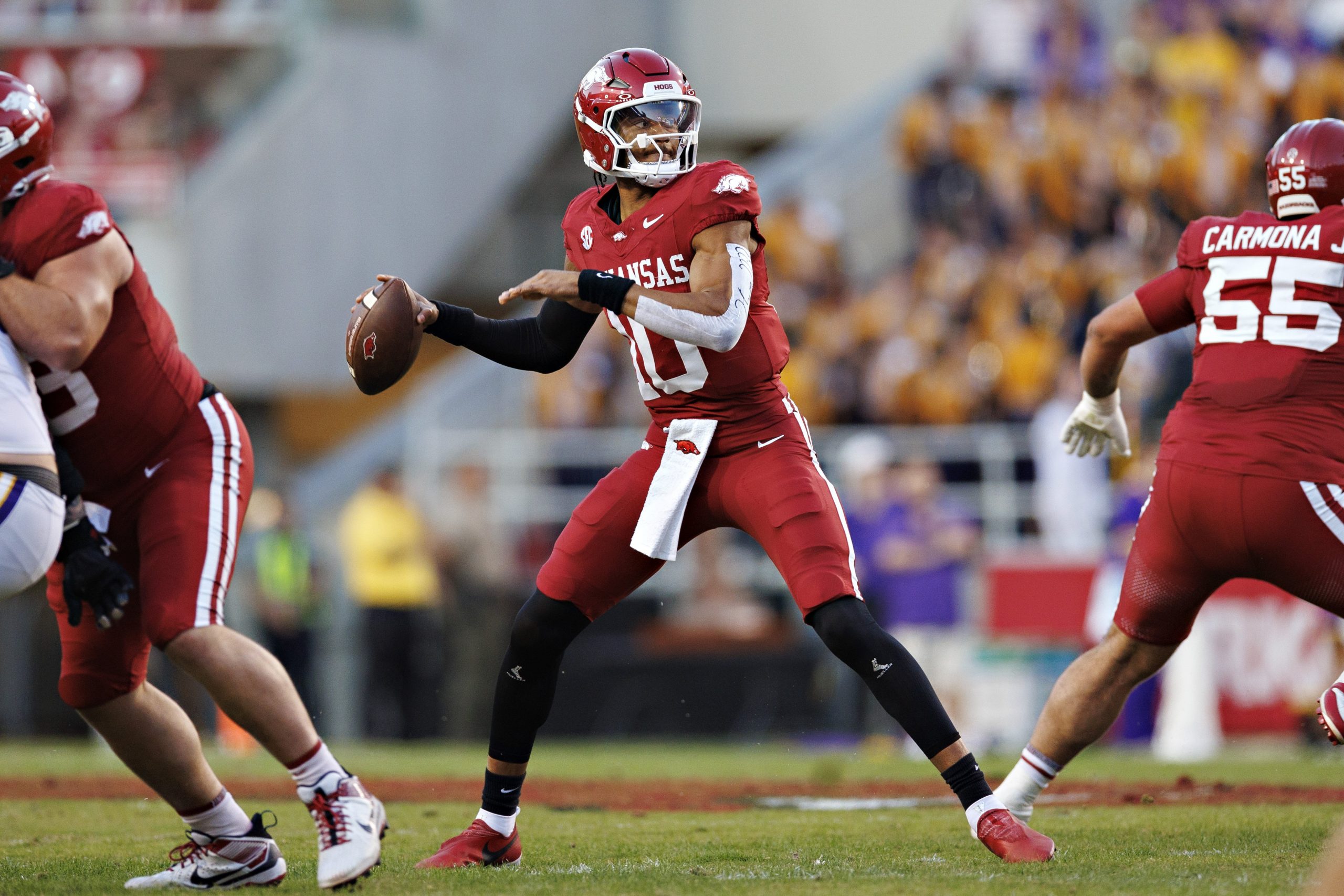 An Arkansas player attempts to throw the football.