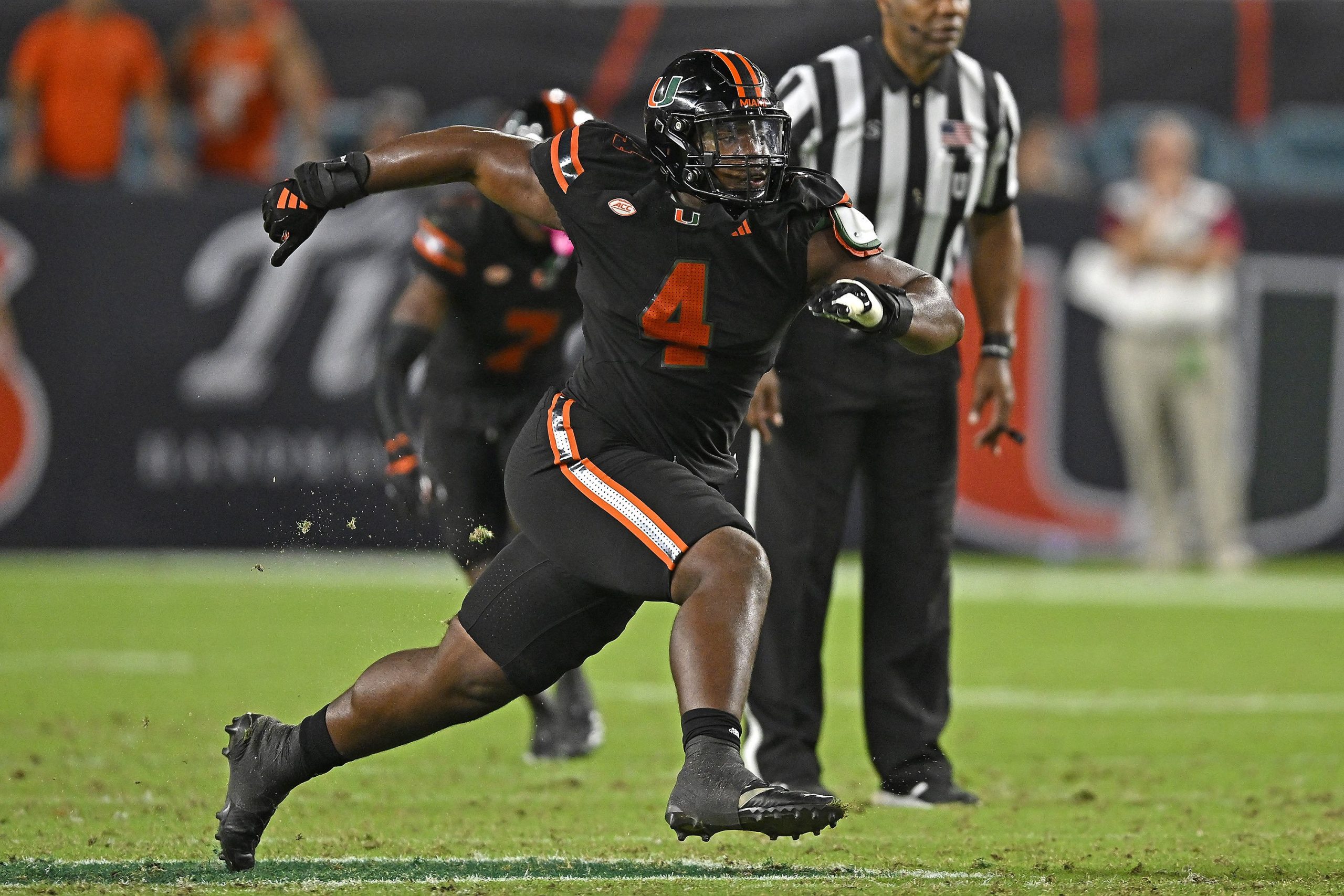 A Miami player runs down the field with the ball.