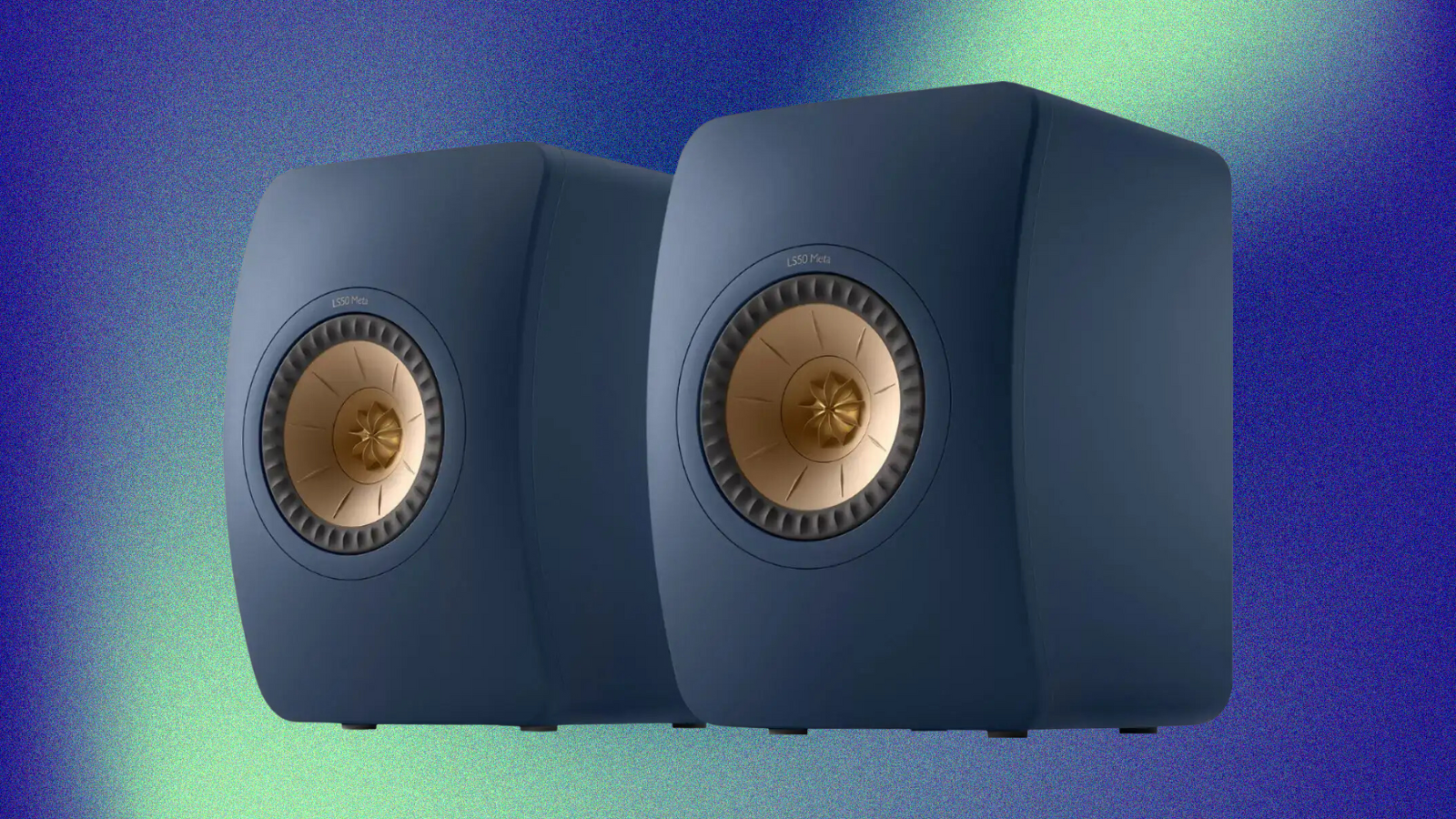 KEF LS50 Meta bookshelf speakers on a blue aura film grain background