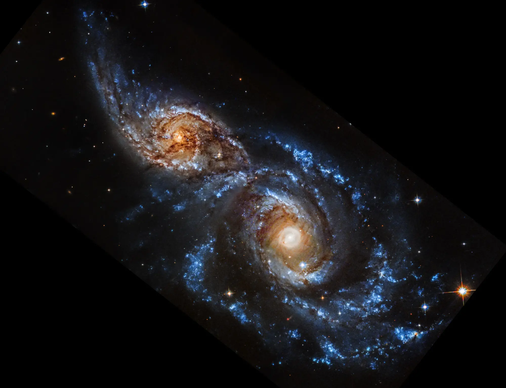 Two galaxies on the verge of merging in ultraviolet light.