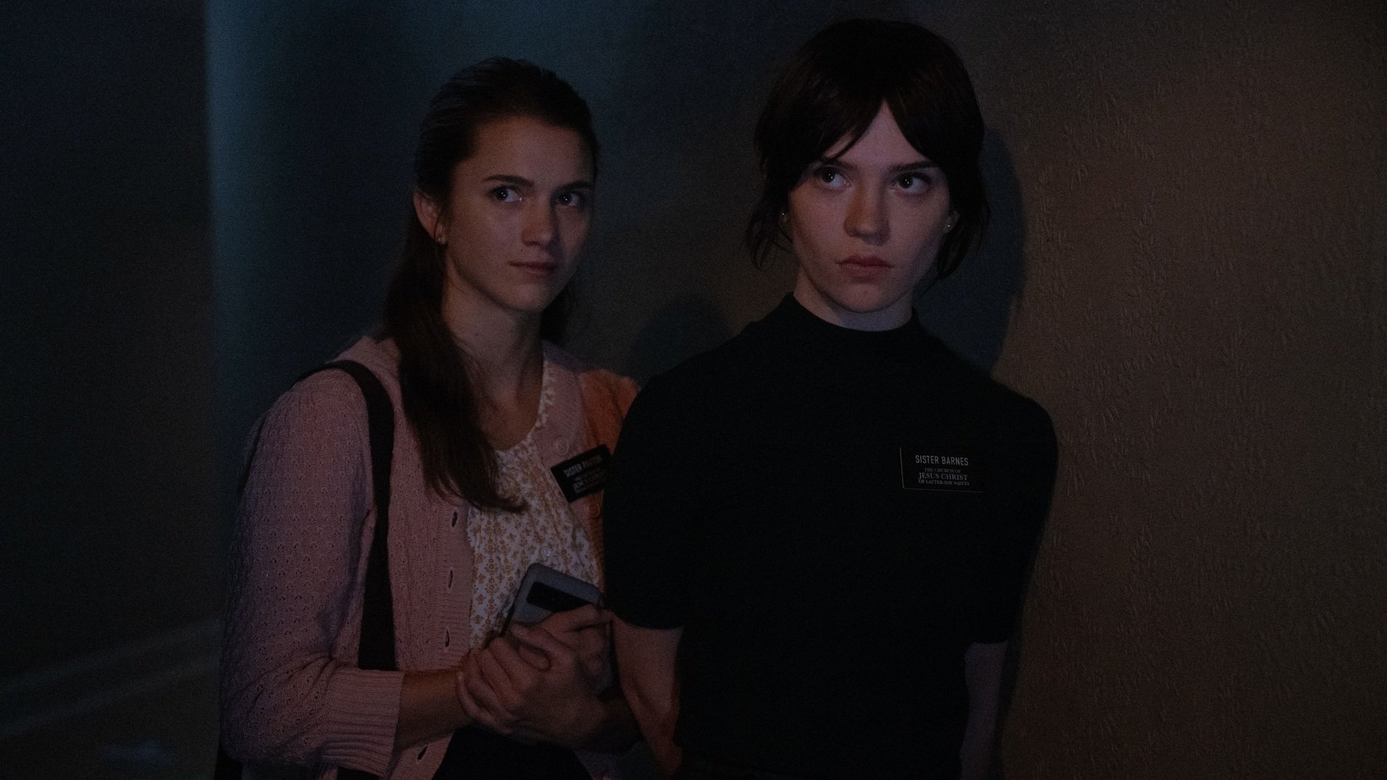 Chloe East and Sophie Thatcher in "Heretic."